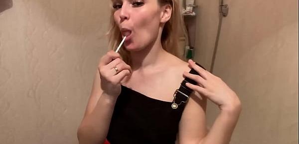  Charming Lady in Sexy Lingerie Licking Lollipop